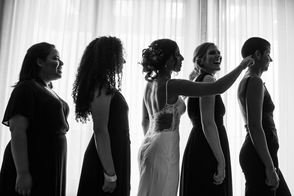 black and white photograph of bride with bridesmaids
