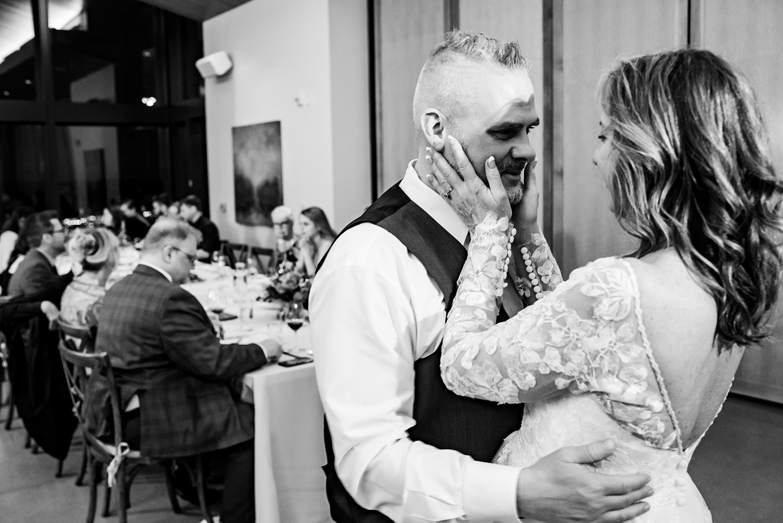 a bride and groom sharing a dance at their wedding reception.